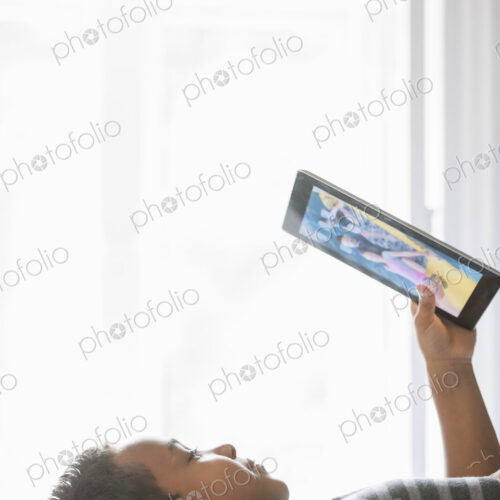 Boy using a tablet. Boy using a tablet.