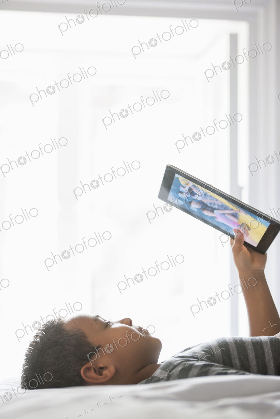 Boy using a tablet.