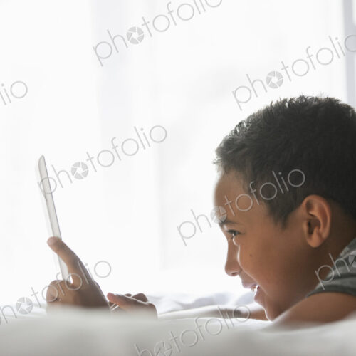 Boy using a tablet. Boy using a tablet.