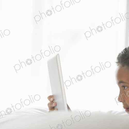 Boy using a tablet. Boy using a tablet.