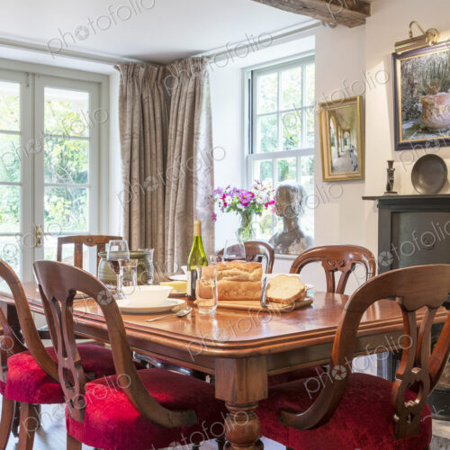 Bread and cutting board on dining table