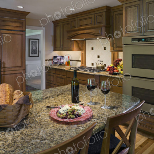 Bread, plate of cheese and olives with wine in kitchen Bread, plate of cheese and olives with wine in kitchen