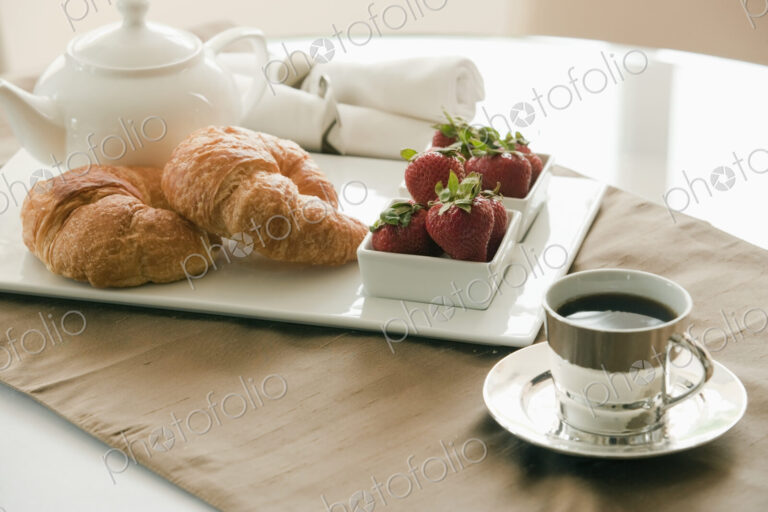 Breakfast Setting on Table, croissants and jam
