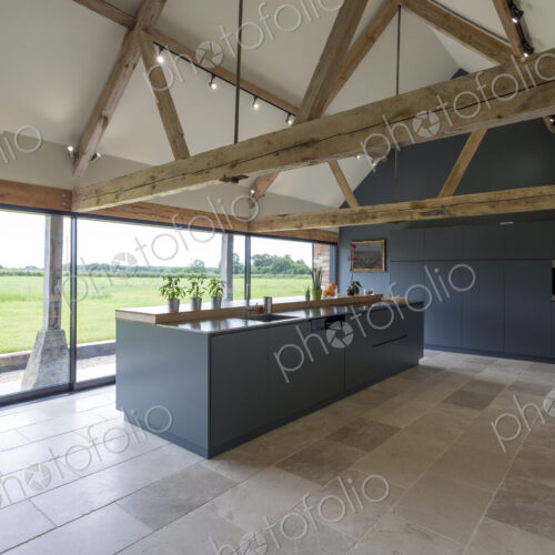 Breakfast bar and glass wall in modern kitchen Breakfast bar and glass wall in modern kitchen