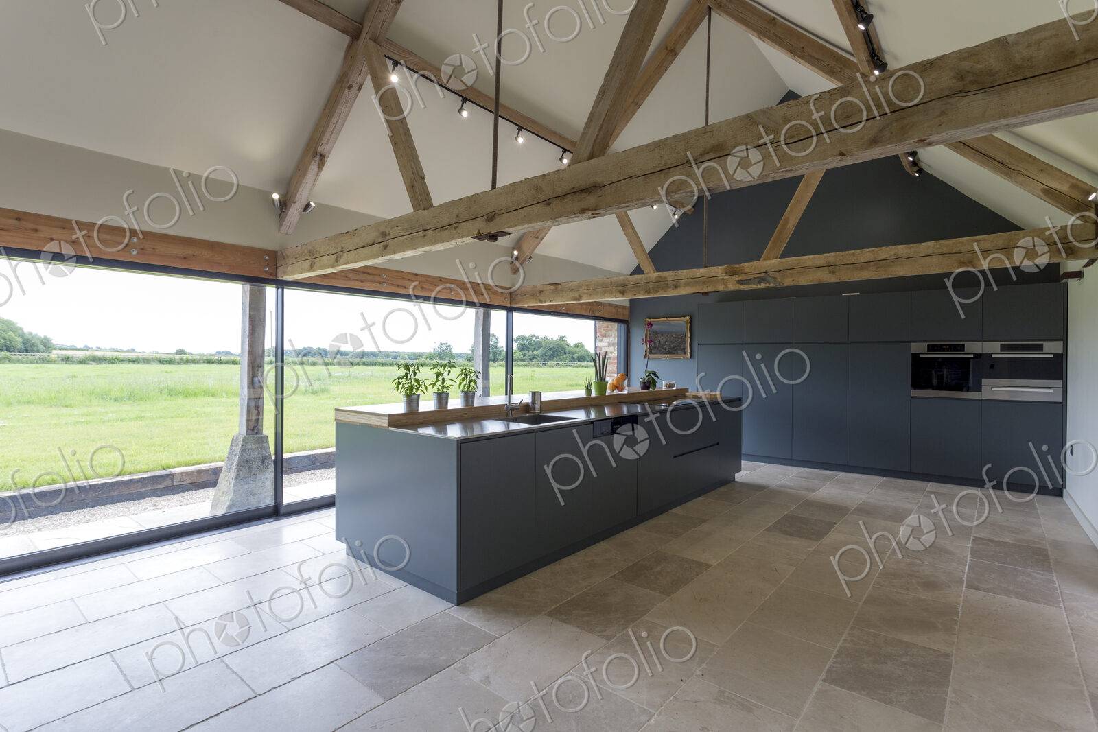 Breakfast bar and glass wall in modern kitchen
