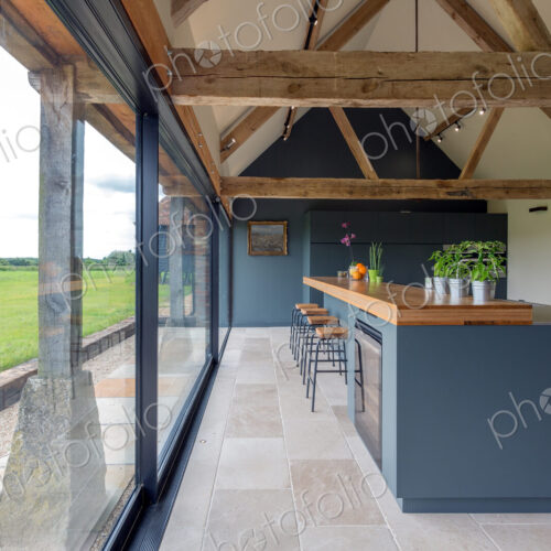 Breakfast bar and glass wall in modern kitchen Breakfast bar and glass wall in modern kitchen