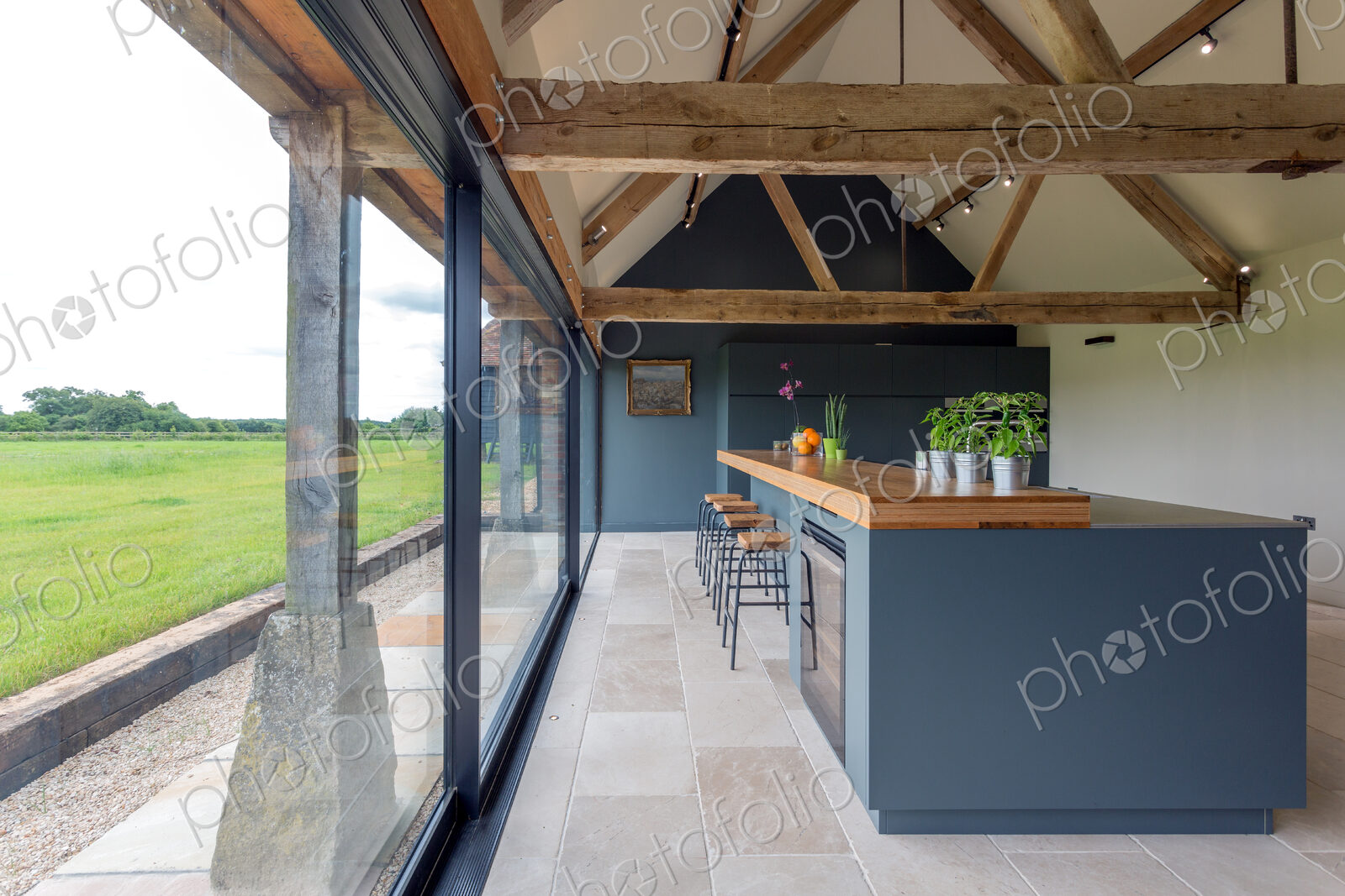 Breakfast bar and glass wall in modern kitchen