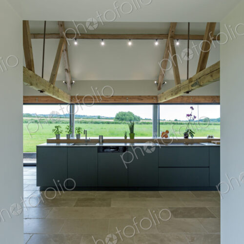 Breakfast bar and glass wall in modern kitchen Breakfast bar and glass wall in modern kitchen