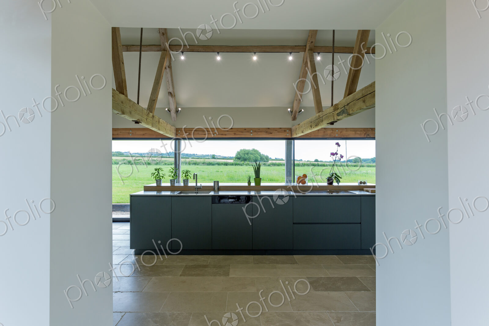 Breakfast bar and glass wall in modern kitchen