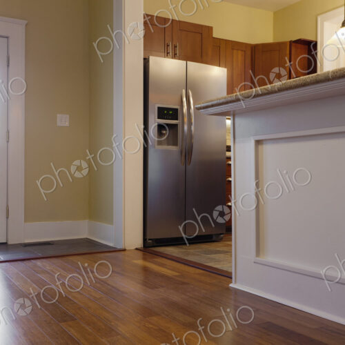 Breakfast bar and refrigerator in kitchen Breakfast bar and refrigerator in kitchen