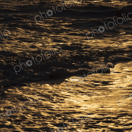Breaking ocean waves, shadows and light reflections on the water surface. Breaking ocean waves, shadows and light reflections on the water surface.