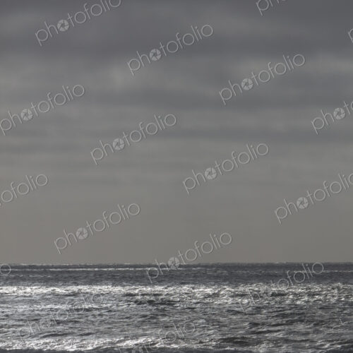 Breaking waves and moody sky at dusk Breaking waves and moody sky at dusk