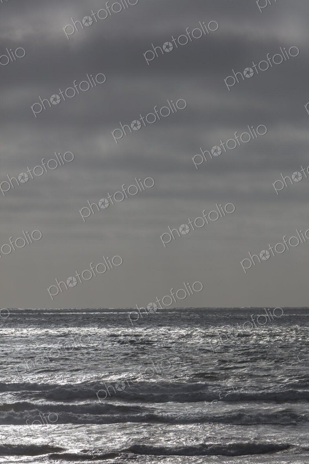 Breaking waves and moody sky at dusk