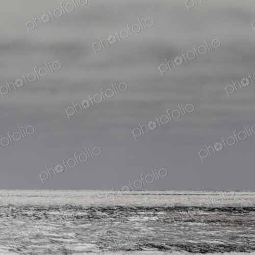 Breaking waves and moody sky at dusk Breaking waves and moody sky at dusk