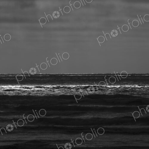 Breaking waves and moody sky at dusk Breaking waves and moody sky at dusk