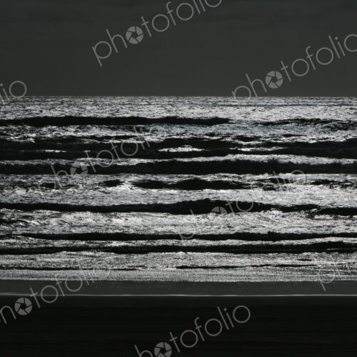Breaking waves and moody sky at dusk Breaking waves and moody sky at dusk
