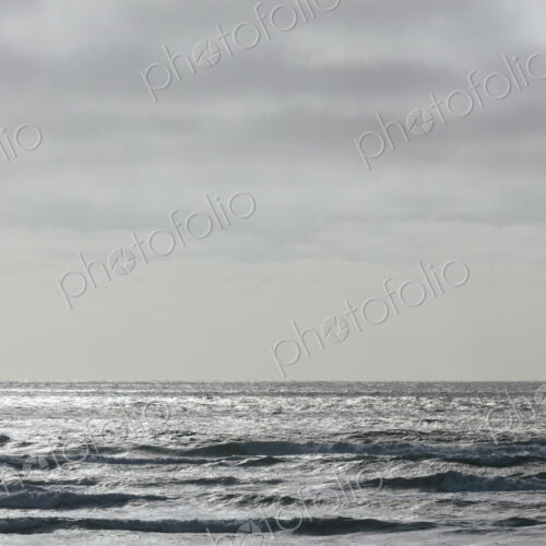 Breaking waves and moody sky at dusk Breaking waves and moody sky at dusk