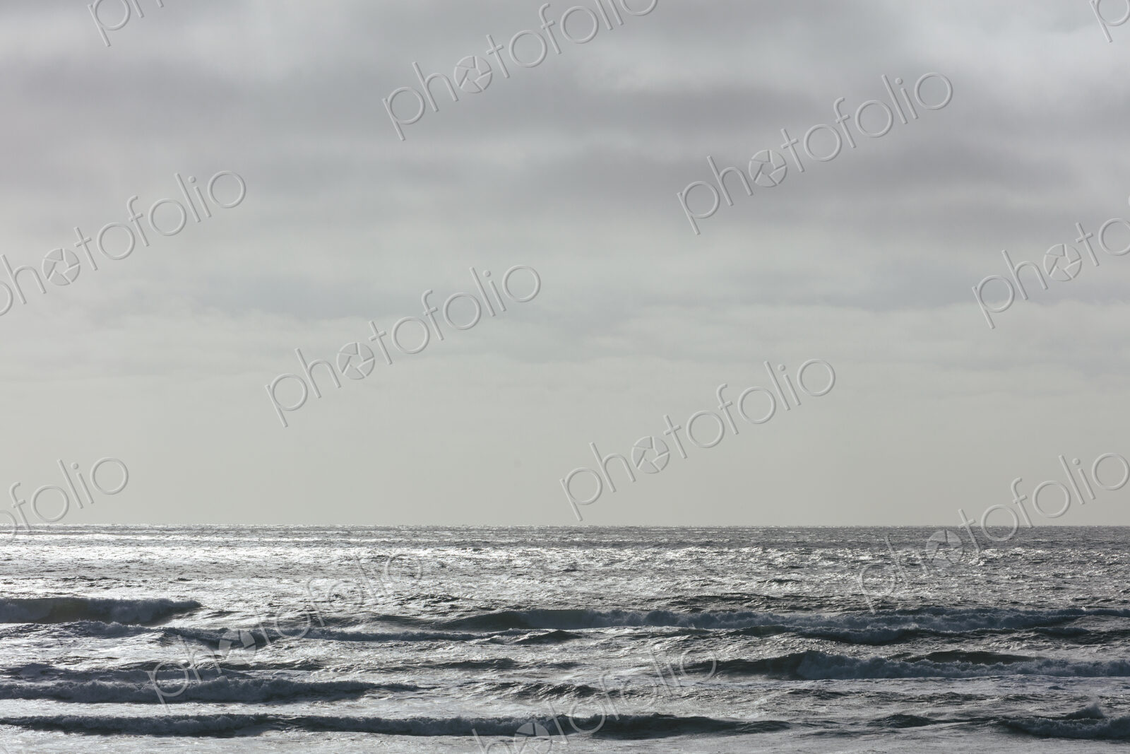 Breaking waves and moody sky at dusk