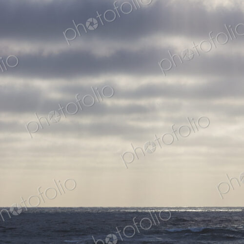 Breaking waves and moody sky at dusk Breaking waves and moody sky at dusk