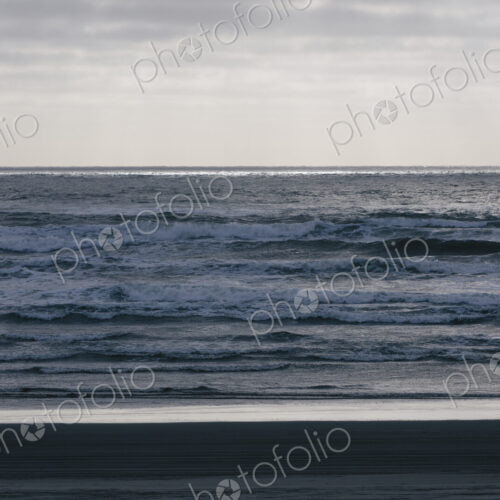 Breaking waves and moody sky at dusk Breaking waves and moody sky at dusk