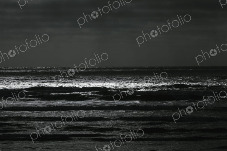 Breaking waves and moody sky at dusk
