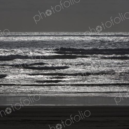 Breaking waves and moody sky at dusk Breaking waves and moody sky at dusk
