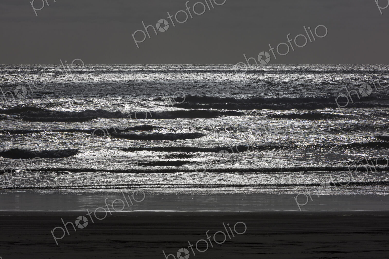 Breaking waves and moody sky at dusk
