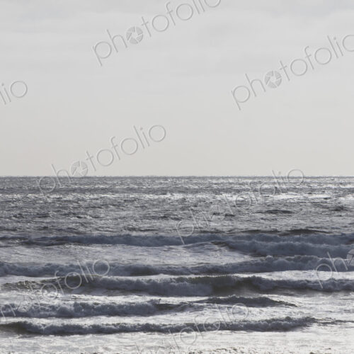 Breaking waves and moody sky at dusk Breaking waves and moody sky at dusk