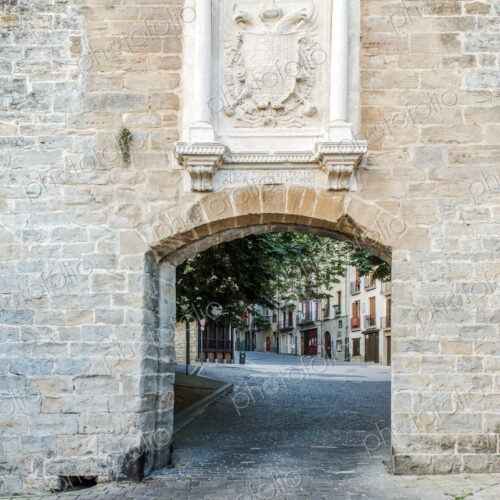 Brick arch in a wall with coat of arms on French Gare.