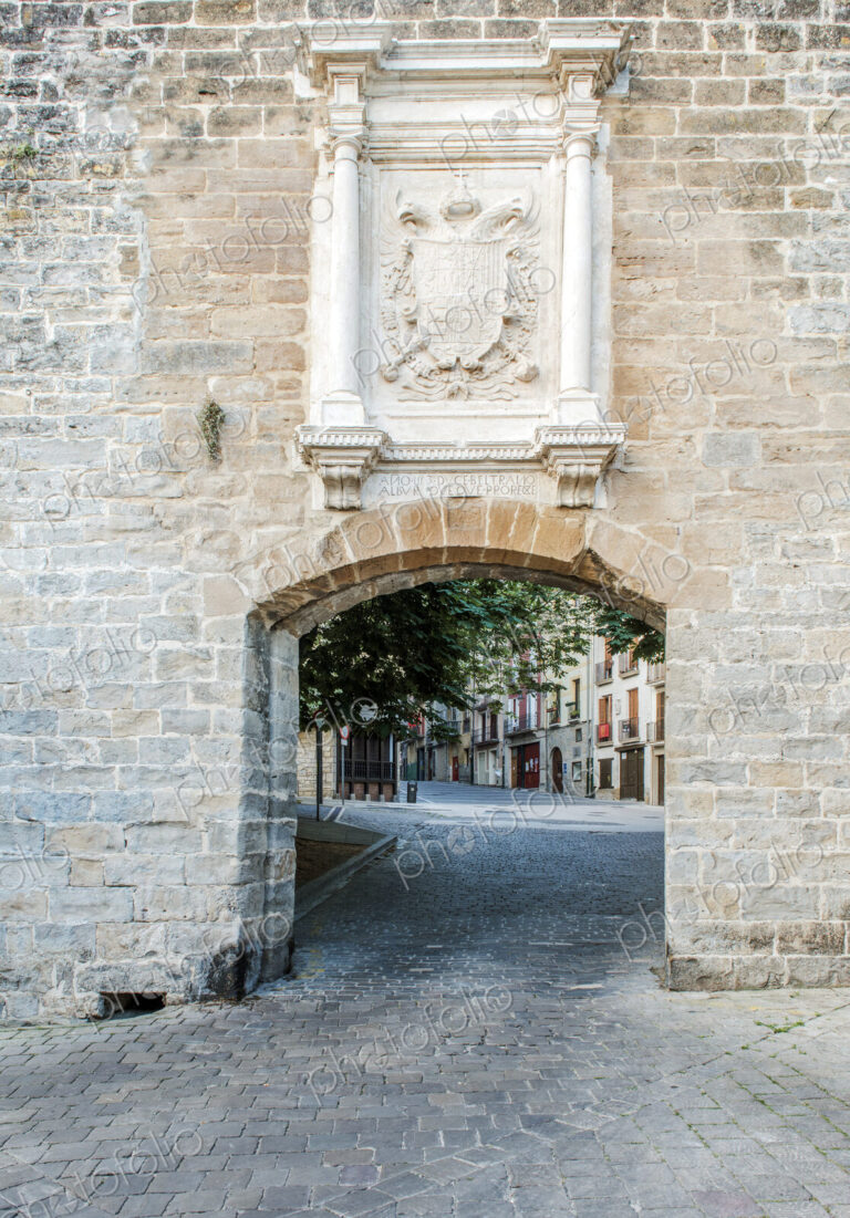 Brick arch in a wall with coat of arms on French Gare.