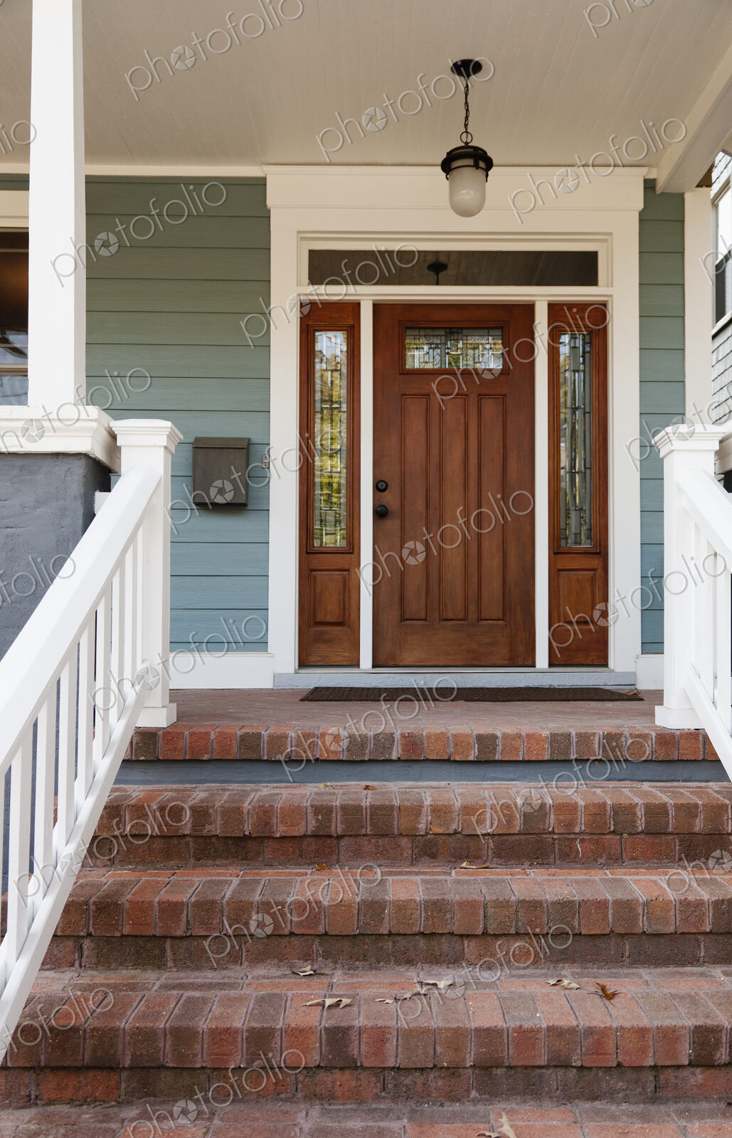 Brick steps and front door of house
