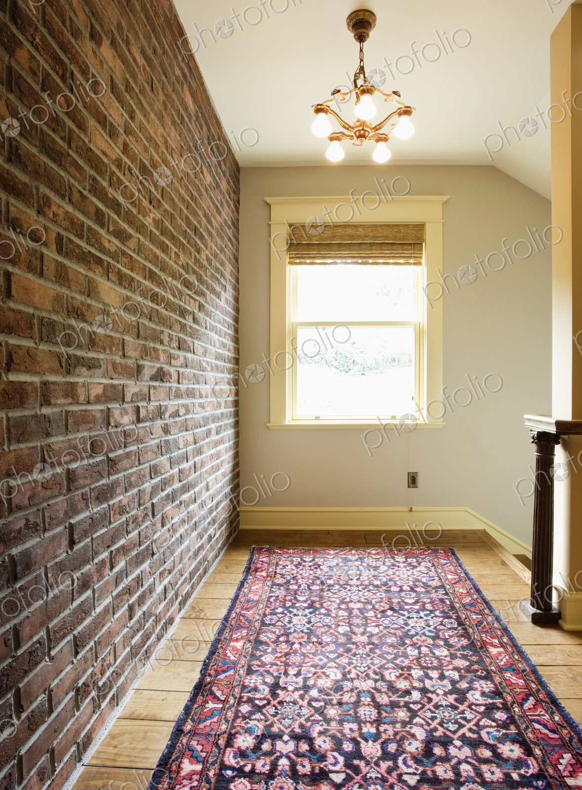 Brick wall along corridor in house