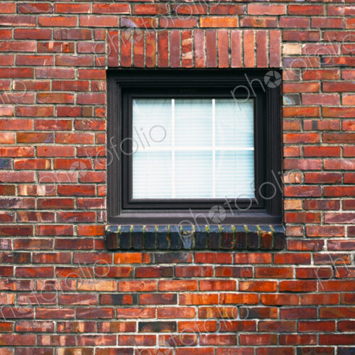 Brick wall of building with window Brick wall of building with window