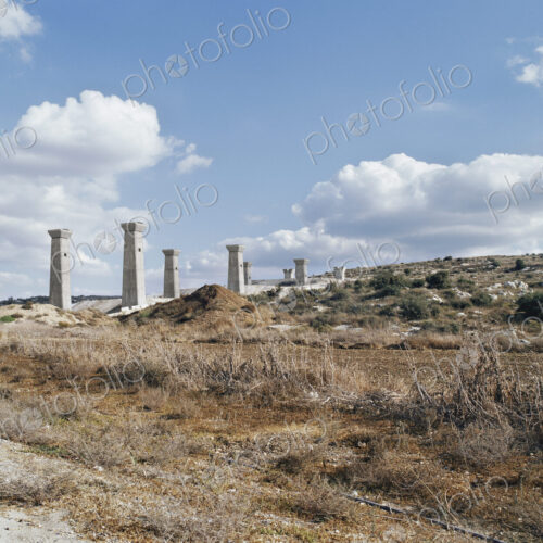 Bridge under construction, pillars and elevated road across an arid landscape. Bridge under construction, pillars and elevated road across an arid landscape.