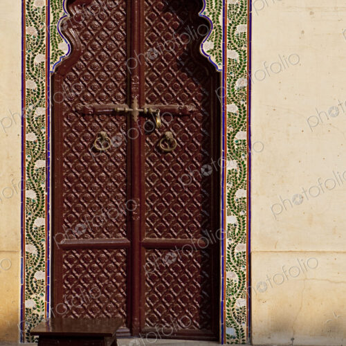Brown Ornate Arched Door in the City Palace Brown Ornate Arched Door in the City Palace