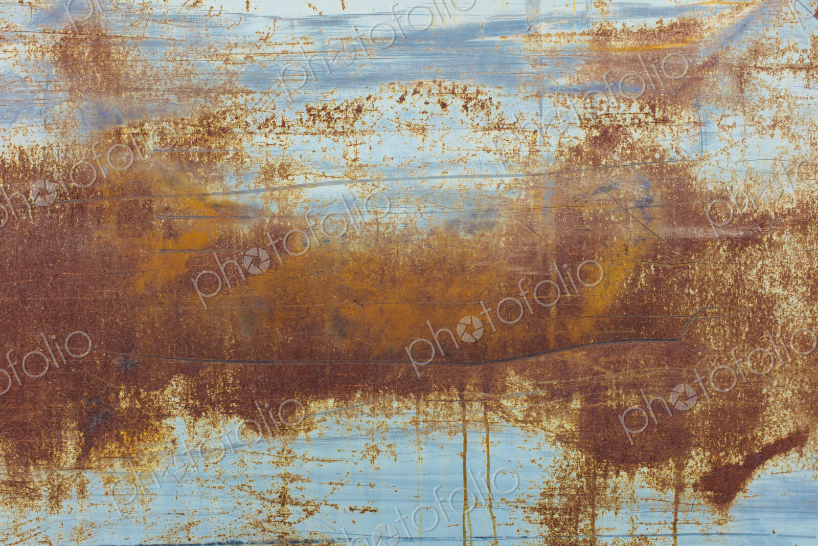 Brown rusting patches on an old wall