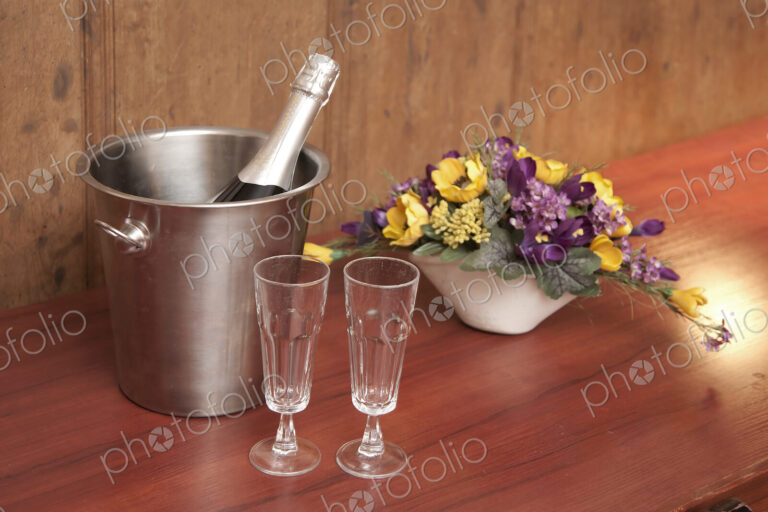 Bucket With Champagne and Two Glasses