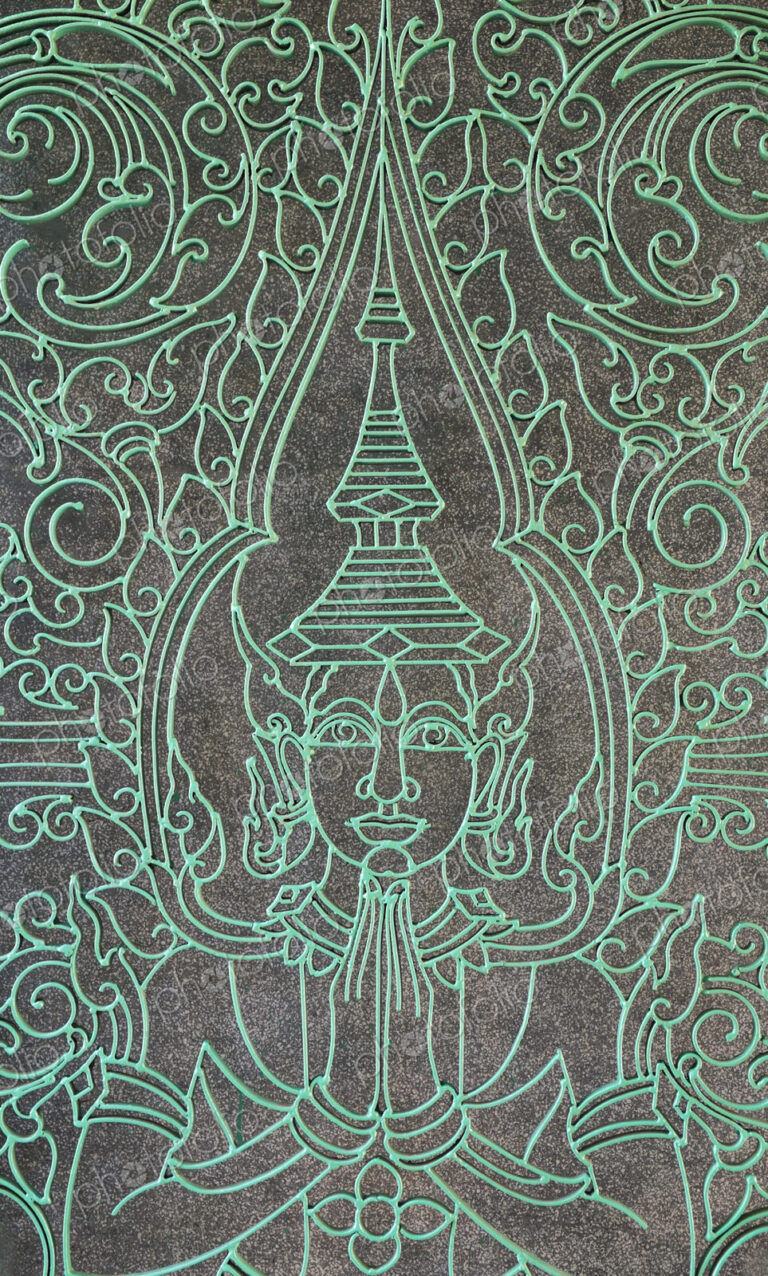 Buddha figure engraved into the Victory Gate at the Royal Palace.