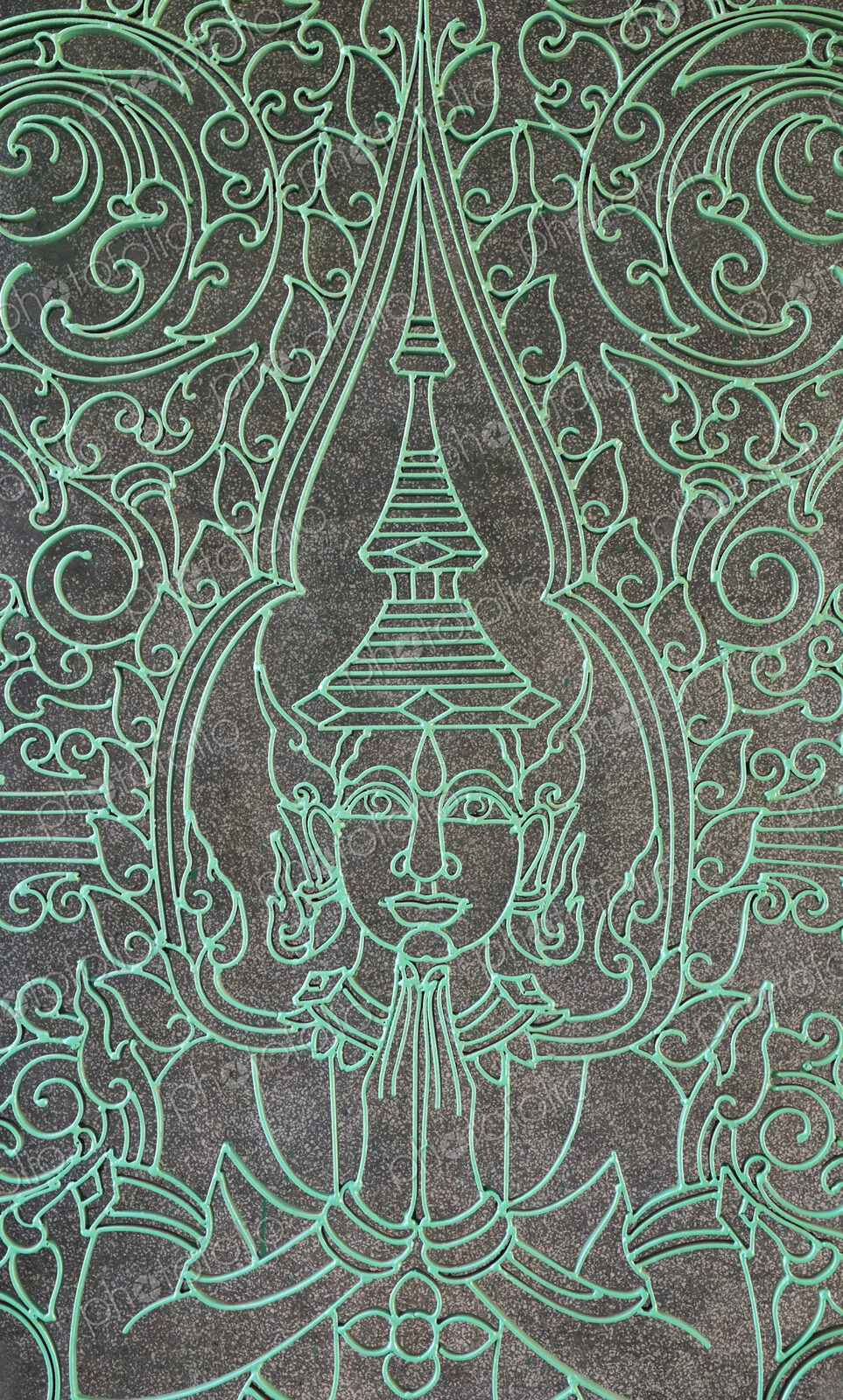 Buddha figure engraved into the Victory Gate at the Royal Palace.