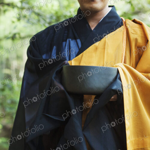 Buddhist monk carrying an alms bowl Buddhist monk carrying an alms bowl