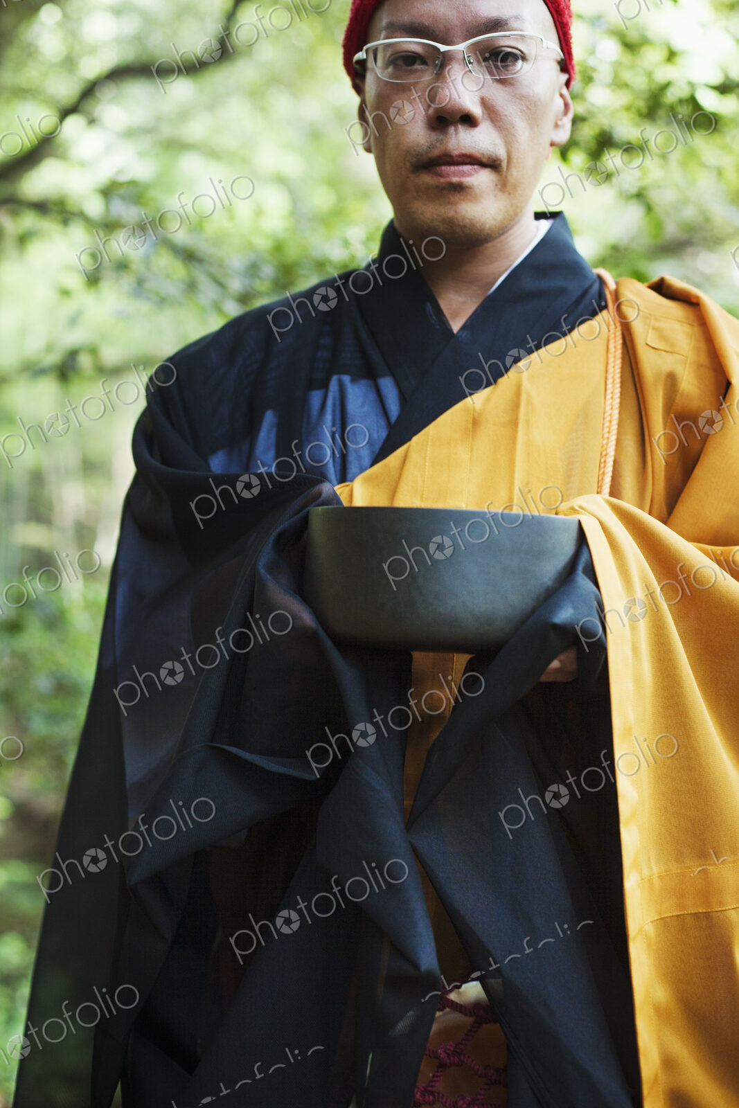 Buddhist monk carrying an alms bowl