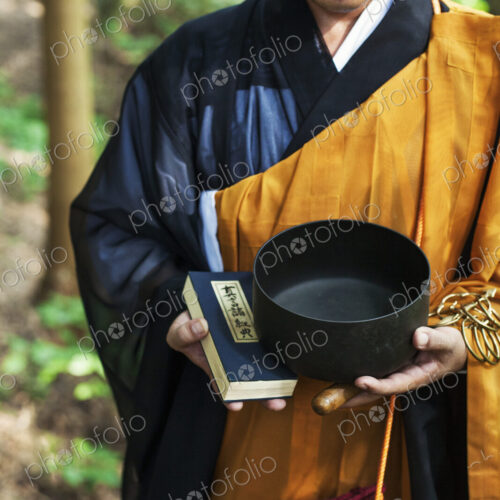 Buddhist monk carrying an alms bowl Buddhist monk carrying an alms bowl