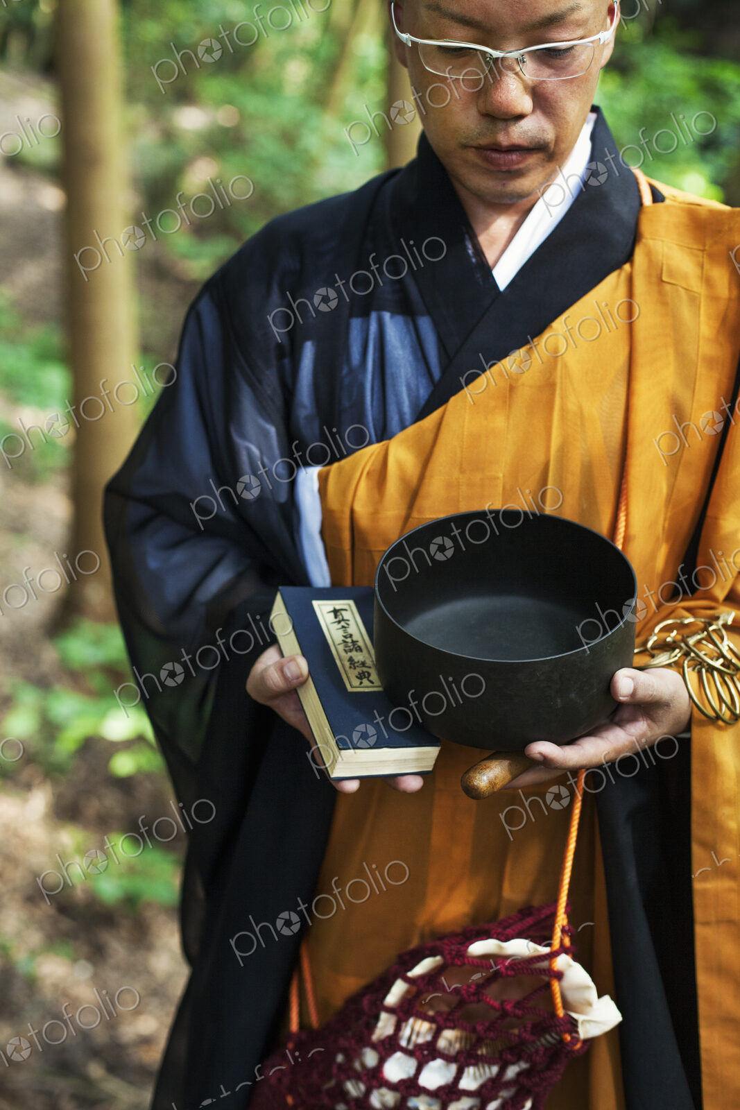 Buddhist monk carrying an alms bowl
