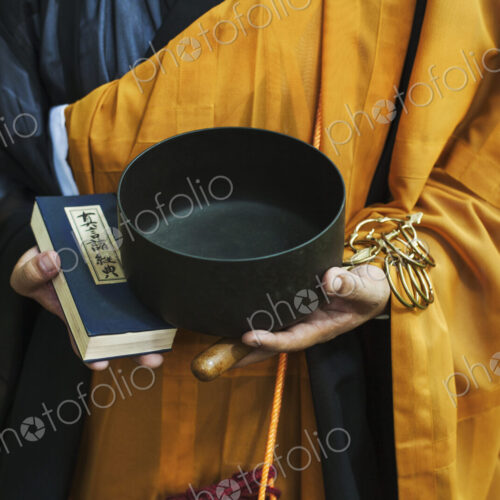 Buddhist monk carrying an alms bowl Buddhist monk carrying an alms bowl