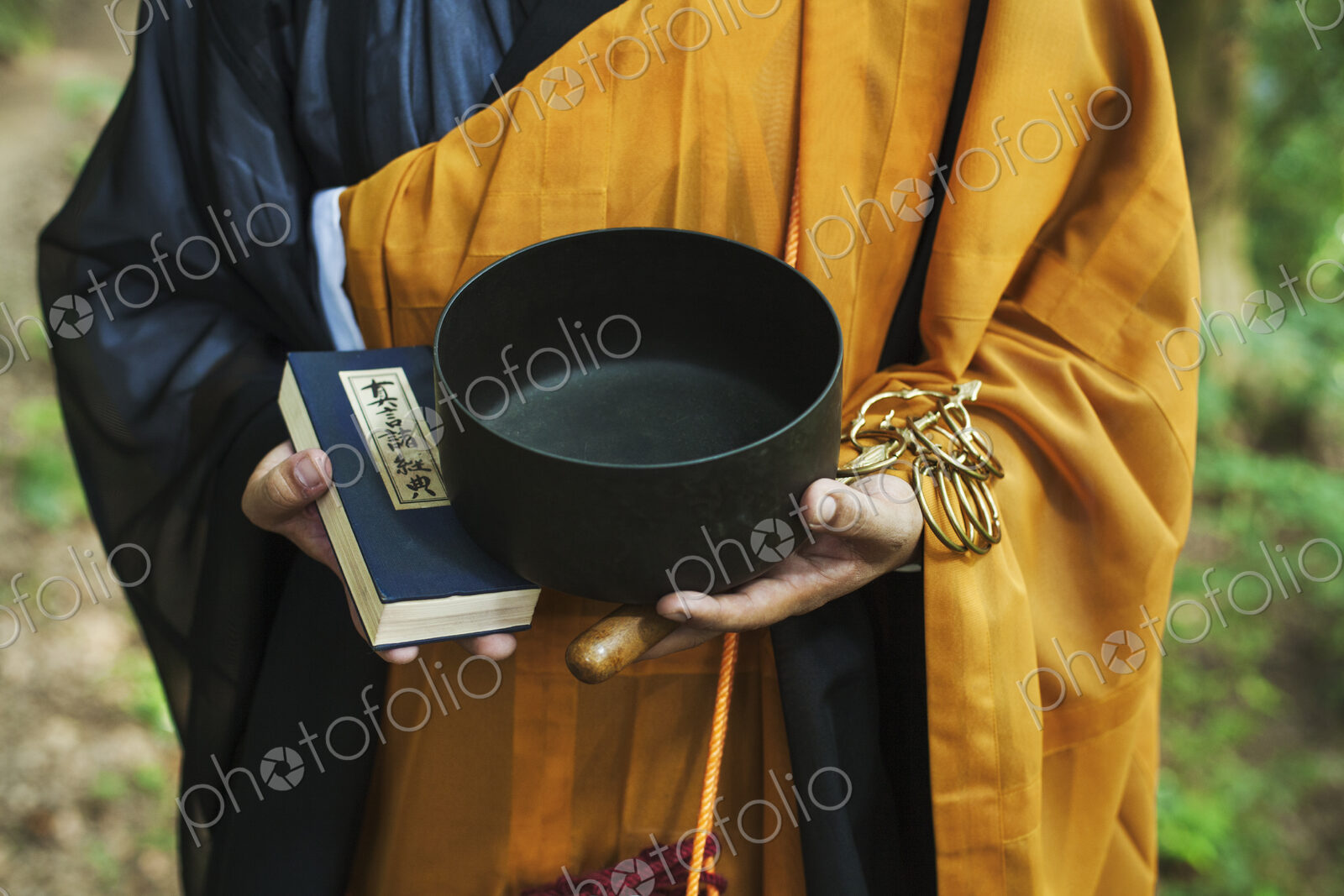 Buddhist monk carrying an alms bowl