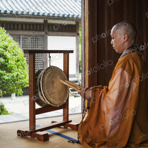 Buddhist monk in a golden robe worshipping Buddhist monk in a golden robe worshipping