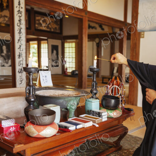 Buddhist priest kneeling in Buddhist temple, praying. Buddhist priest kneeling in Buddhist temple, praying.