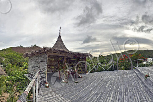 Buildings With Thatched Roofs On Tropical Island