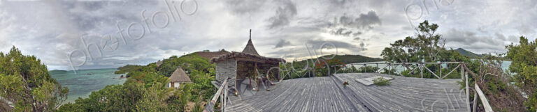 Buildings With Thatched Roofs On Tropical Island