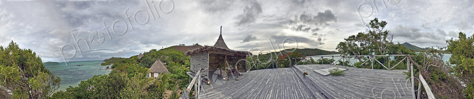 Buildings With Thatched Roofs On Tropical Island